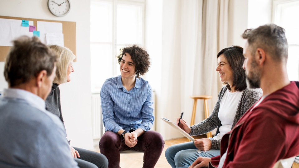 Peer Support Group - seated group of people chatting